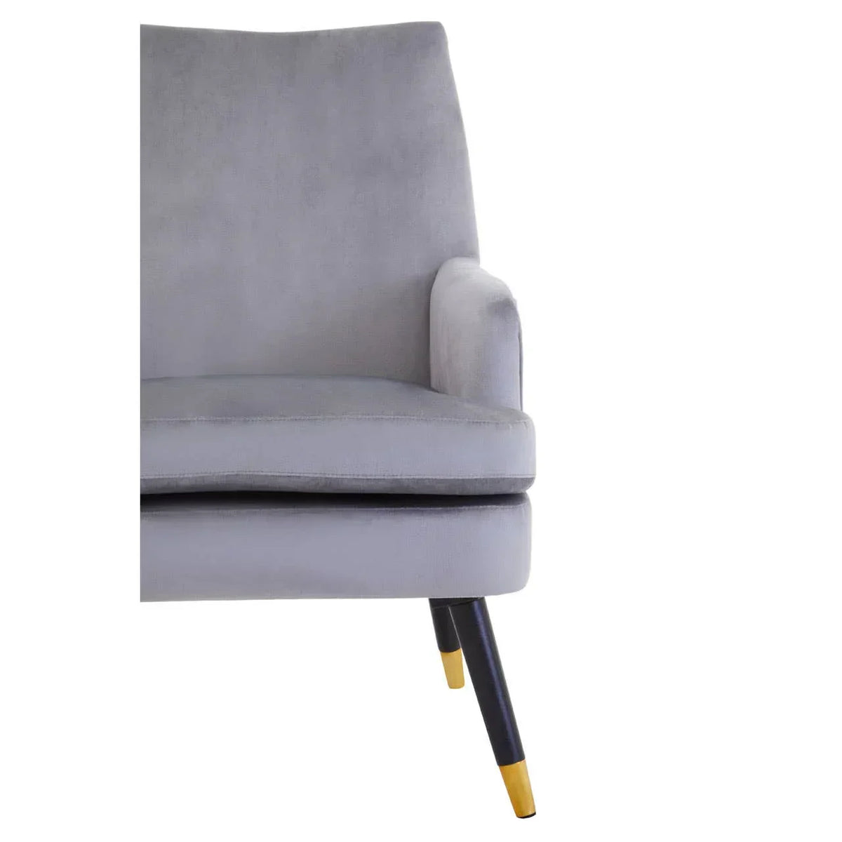 Light grey accent chair with padded seat, fabric upholstery, black wooden legs and gold tips