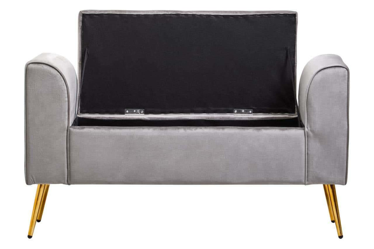 Grey upholstered storage bench with open lid and gold metal legs, front view
