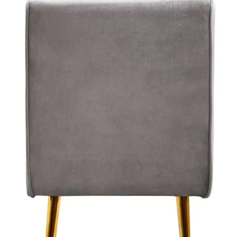 Grey velvet armchair back view with gold metal legs