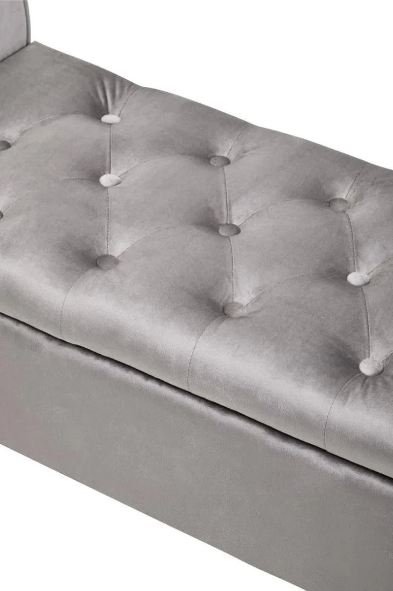 Grey velvet ottoman bench with tufted button detail, close view of cushioned top