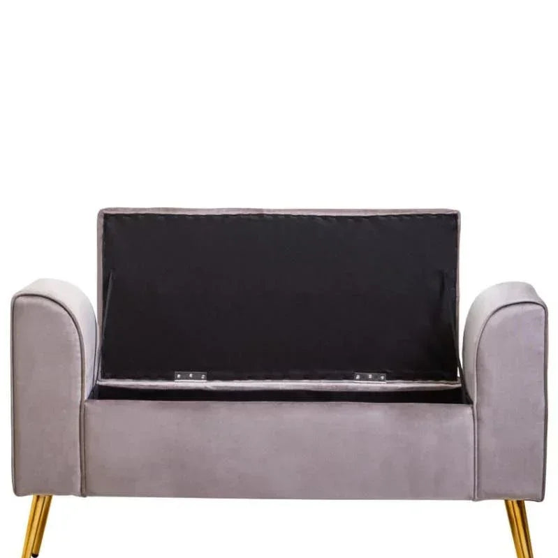 Grey velvet storage bench with open lid and gold metal legs, front view