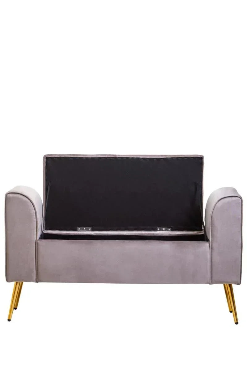 Grey velvet storage bench with open lid and gold metal legs, front view