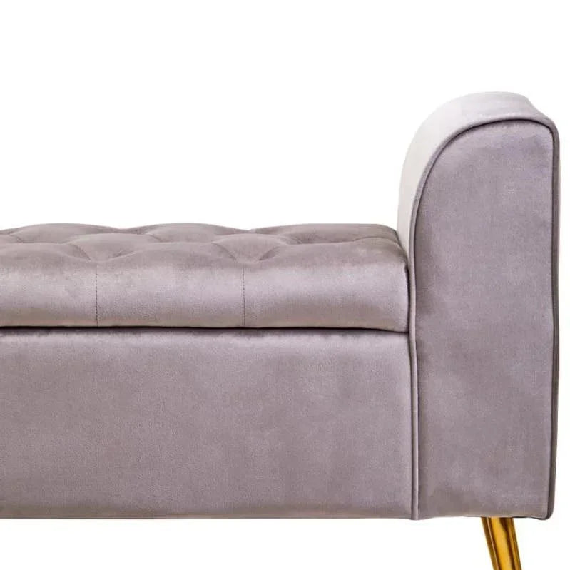 Grey velvet upholstered bench with button-tufted seat and gold metal legs, side view
