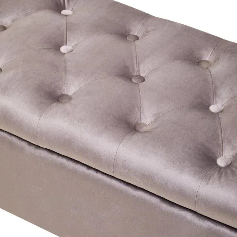 Close up of grey velvet ottoman bench with button-tufted seat upholstery