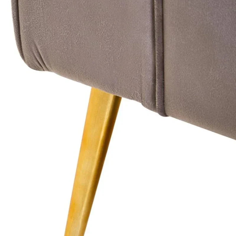 Close-up of grey upholstered sofa corner with wooden tapered leg