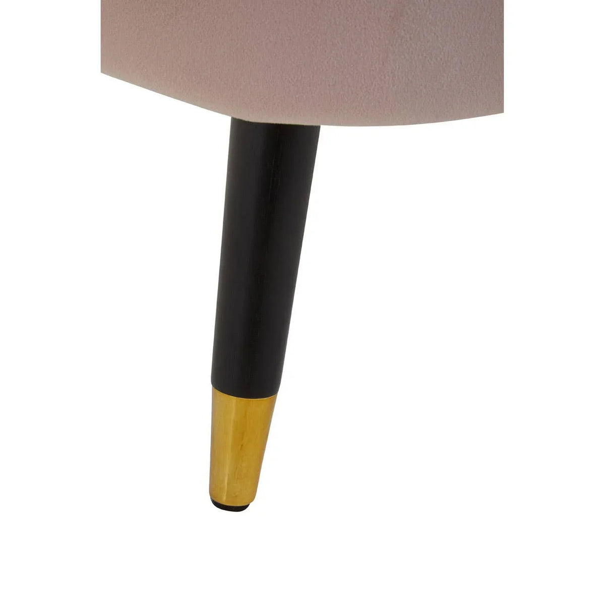 Close-up of upholstered chair leg with black and gold metal finish