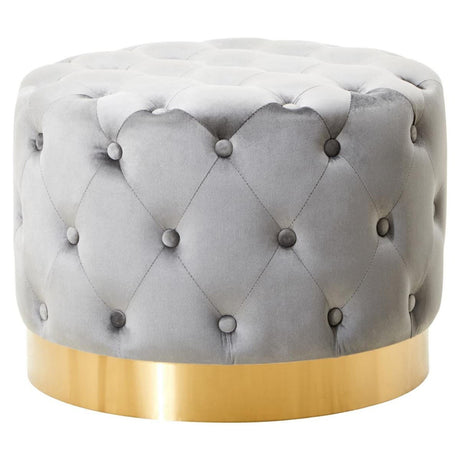 Round grey velvet stool featuring a tufted design with decorative buttons and a matte gold finish metal base. The stool has a plush, soft surface and a sleek, modern aesthetic suitable for various home decor styles