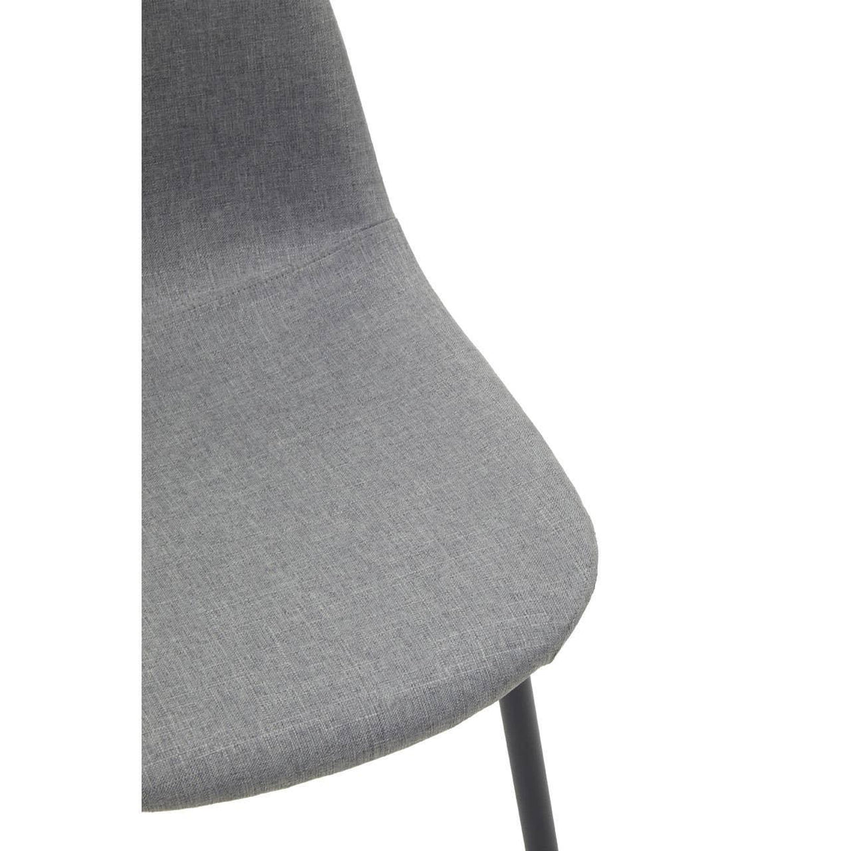 Closeup of modern grey fabric dining chair with black leg