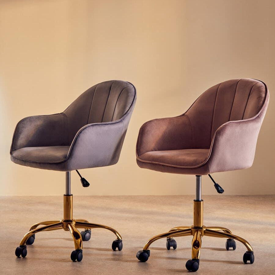 Velvet swivel office chairs in grey and blush pink with gold metal bases on castors