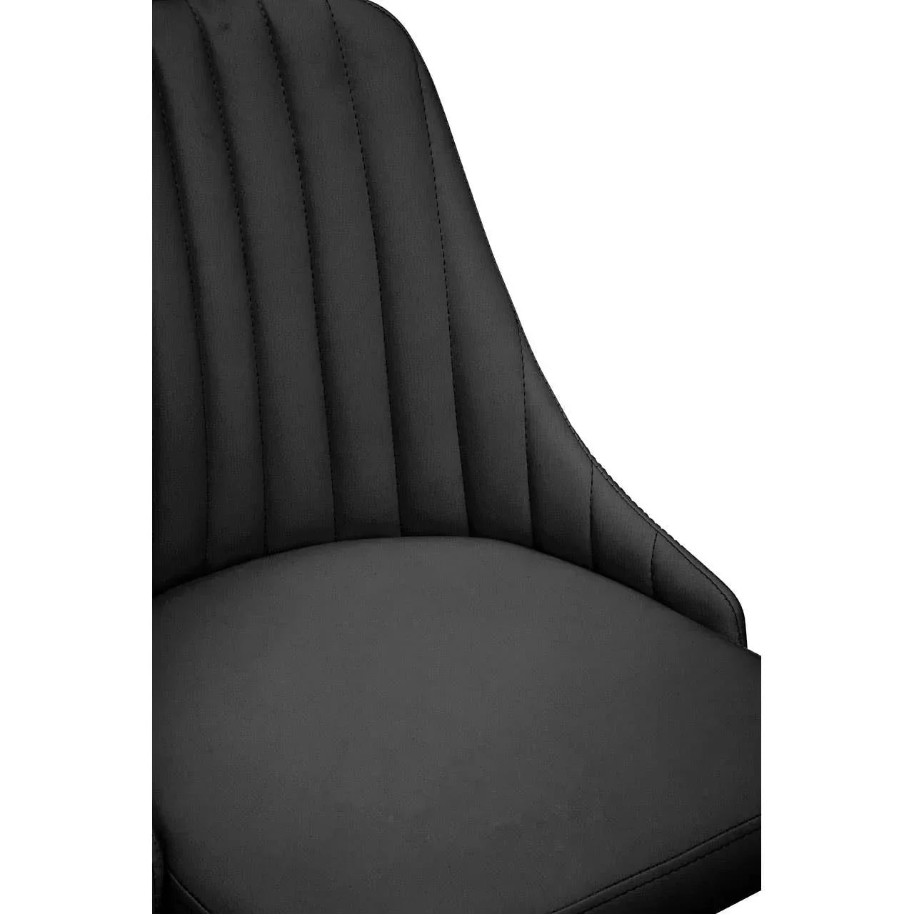 Black upholstered dining chair with vertical stitch detailing on backrest close up