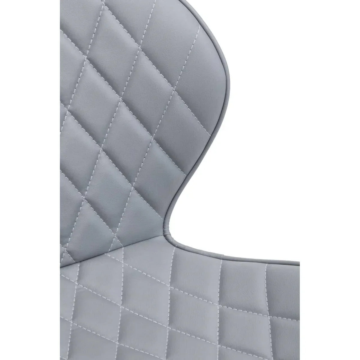 Close-up of grey dining chair with diamond stitched upholstery