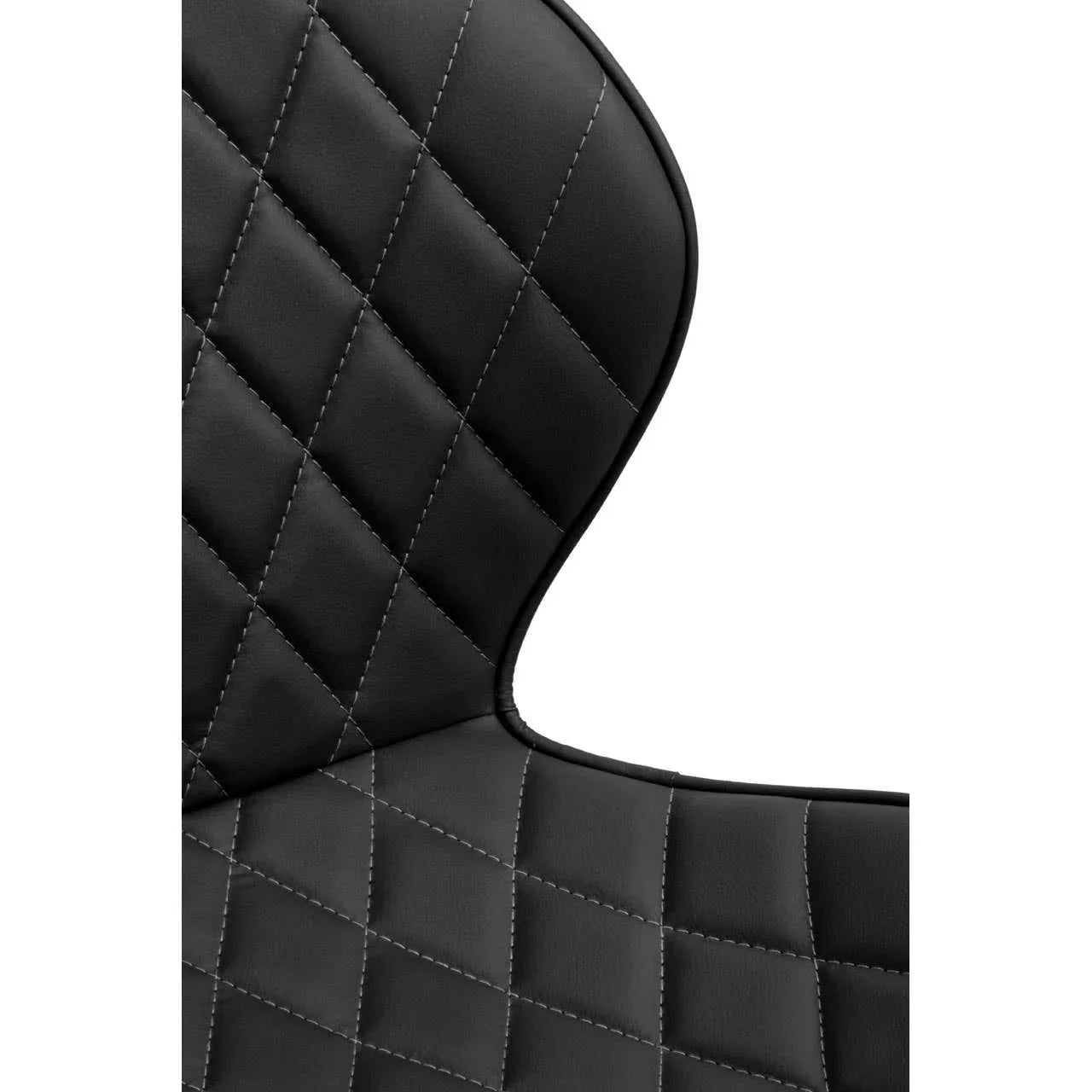 Close up of black dining chair with diamond-stitched faux leather upholstery backrest