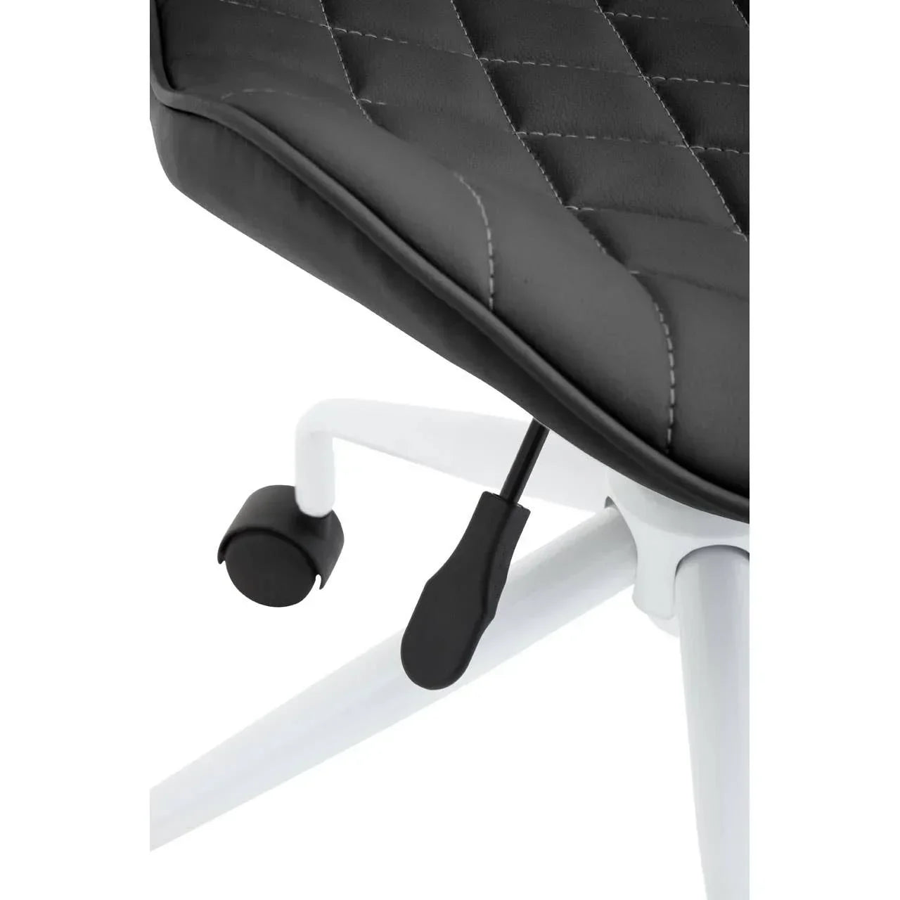 Close-up of black office chair seat with diamond stitching and white metal base on castors