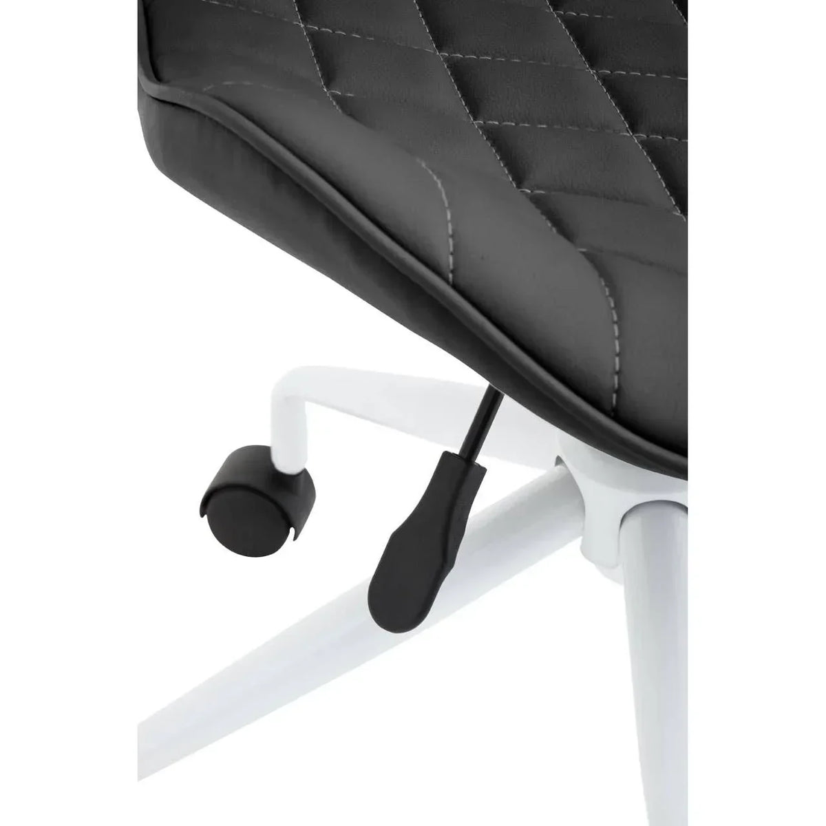 Close-up of black office chair seat with diamond stitching and white metal base on castors