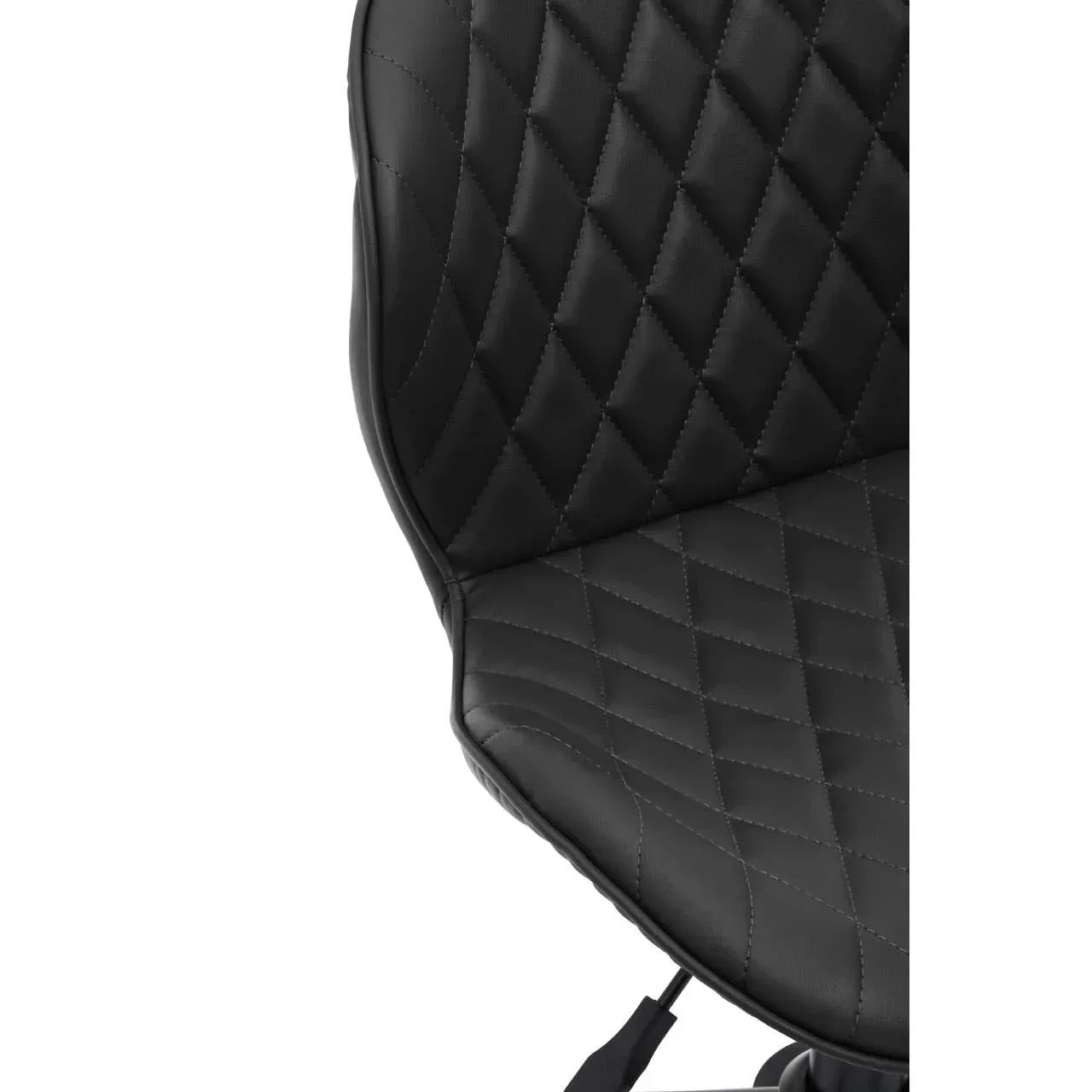 Closeup of black leather chair seat with diamond stitched pattern and curved backrest