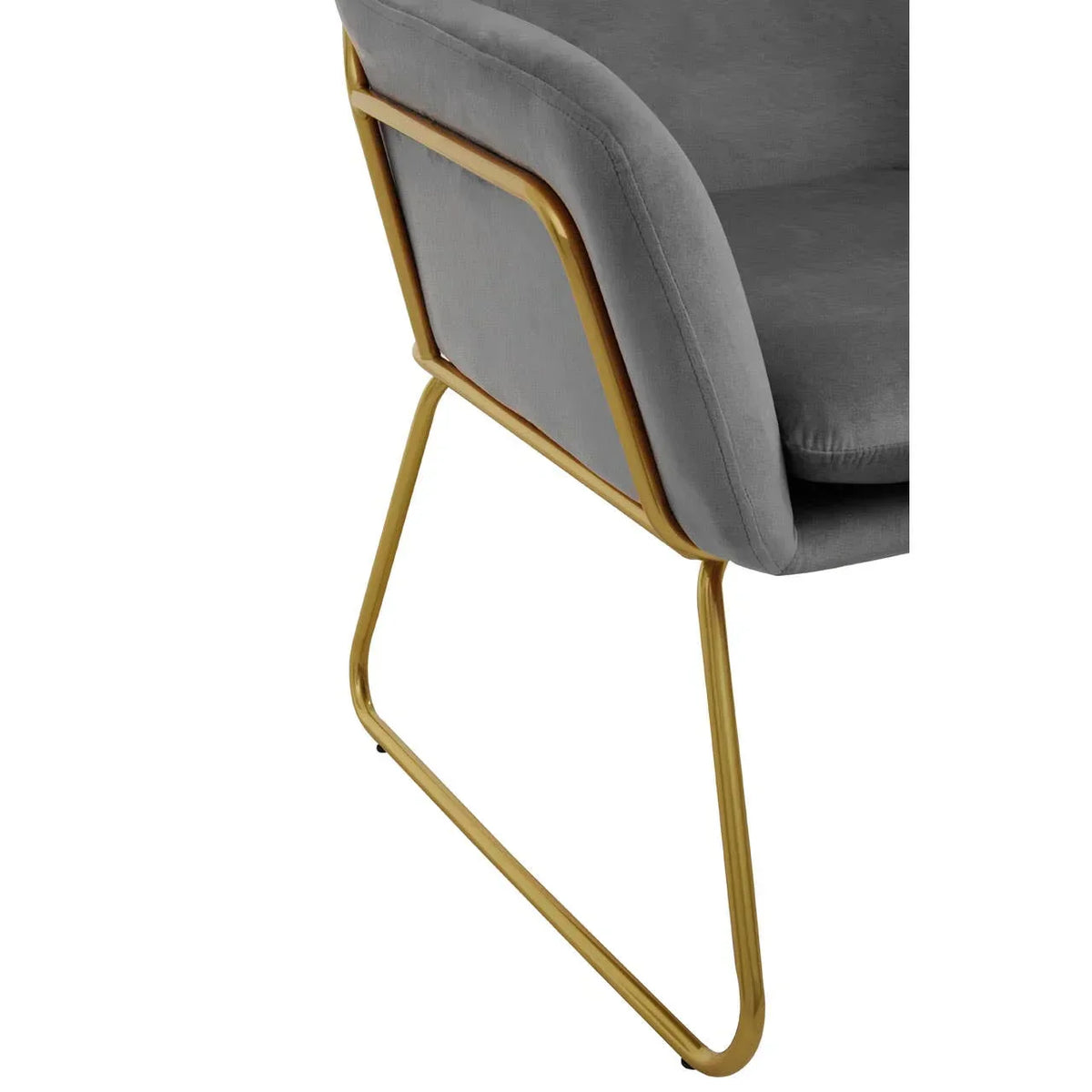 Grey velvet dining chair with gold metal frame, side rear view
