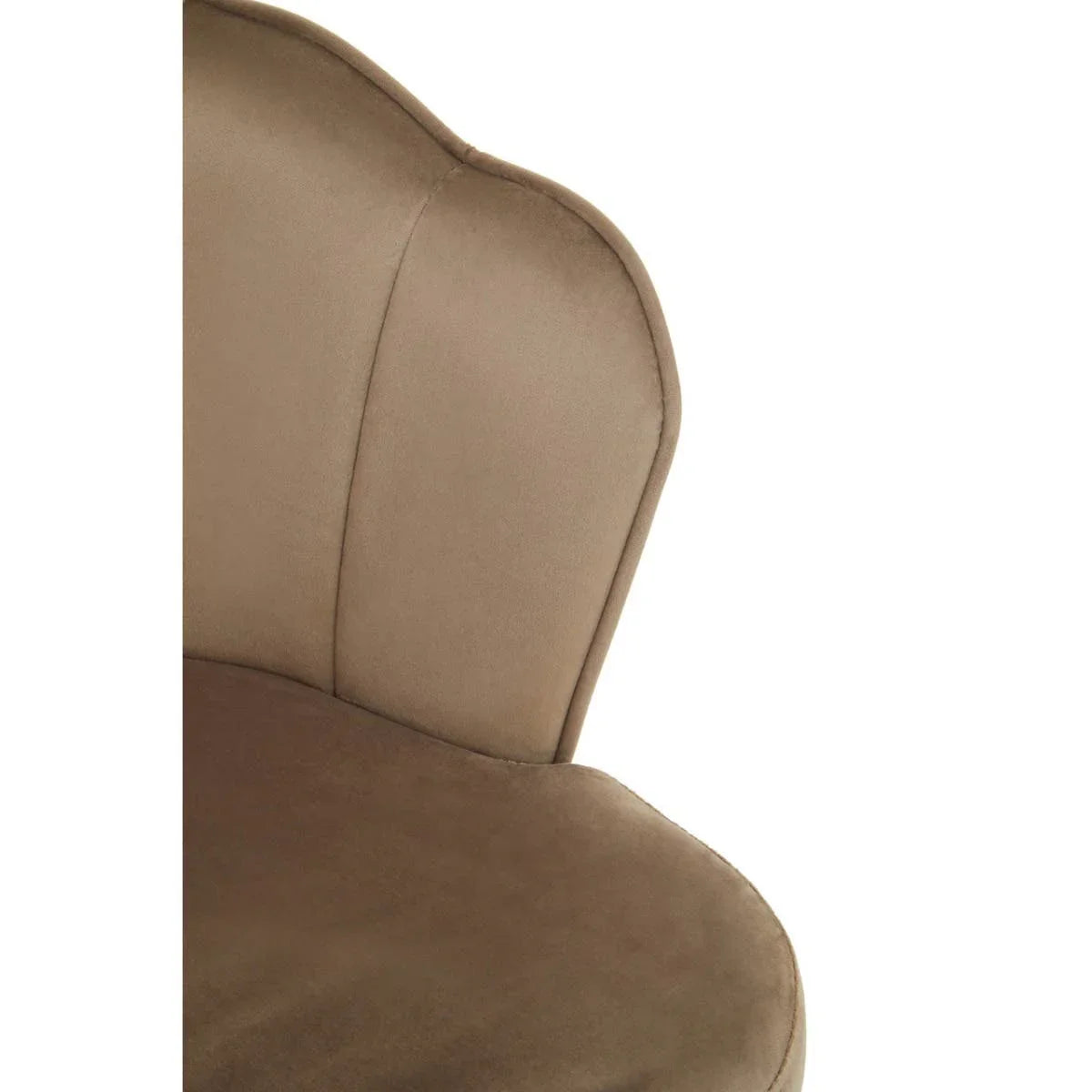 Closeup of brown velvet accent chair with curved padded backrest and seat