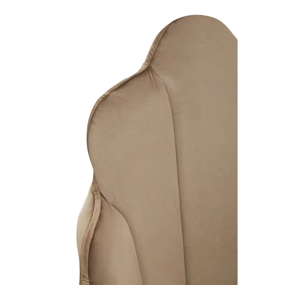 Close up of beige accent chair backrest with curved plush upholstery detail