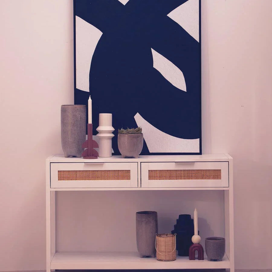 White console table with rattan drawers, modern decor and bold abstract wall art