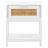 White wood side table featuring a single drawer with a rattan front and an open shelf below. The table has clean lines and a minimalist design, suitable for various home decor styles