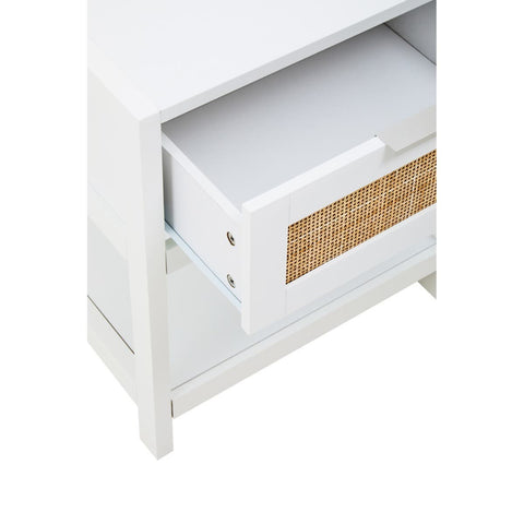 White wood side table featuring a single drawer with a rattan front, showcasing a clean and modern design. The drawer is partially open, revealing the interior space. The table has a simple, sturdy frame and is positioned on four legs