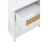 White wood side table featuring a single drawer with a rattan front, showcasing a clean and modern design. The drawer is partially open, revealing the interior space. The table has a simple, sturdy frame and is positioned on four legs