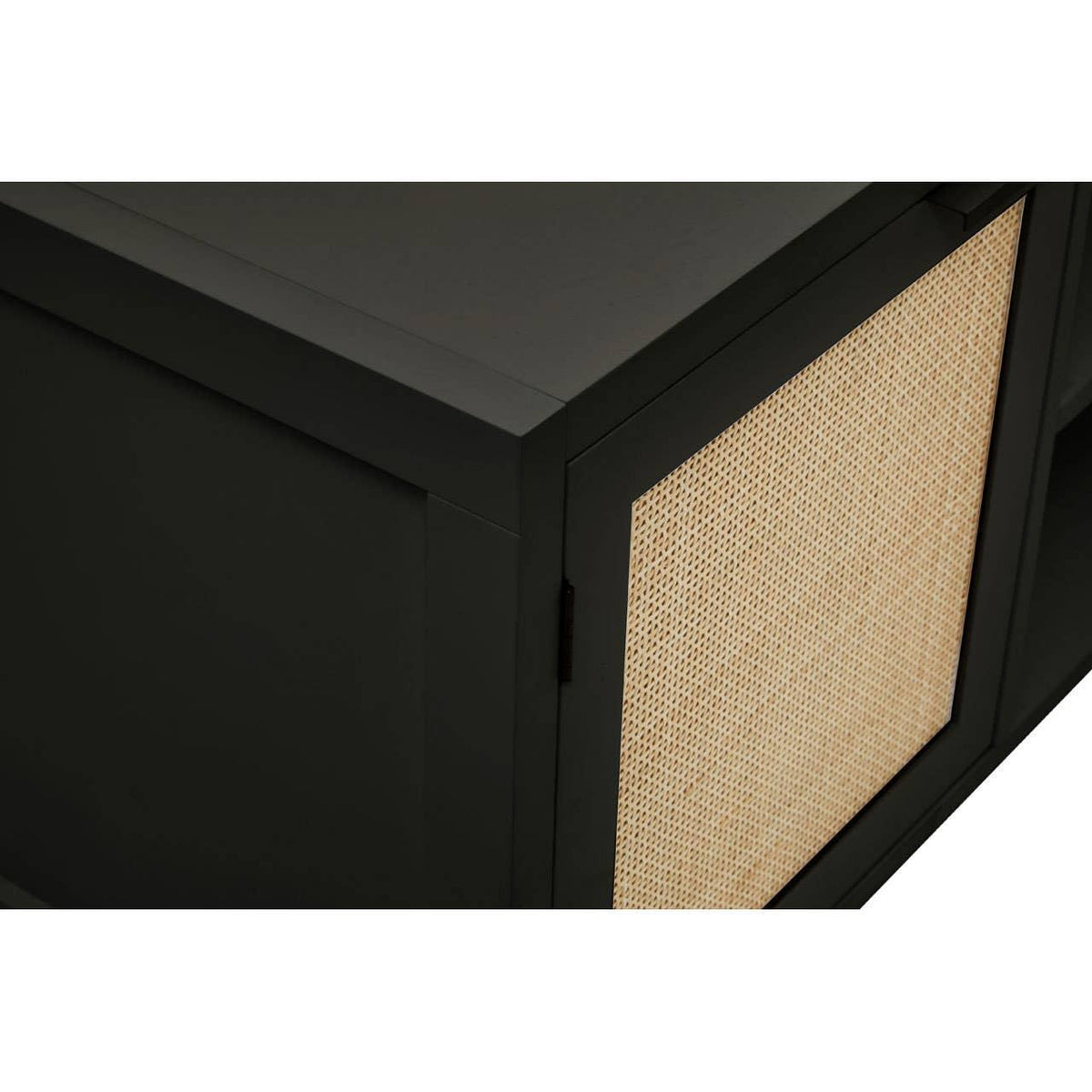 Black sideboard cabinet with natural rattan door panel, close-up of corner and texture