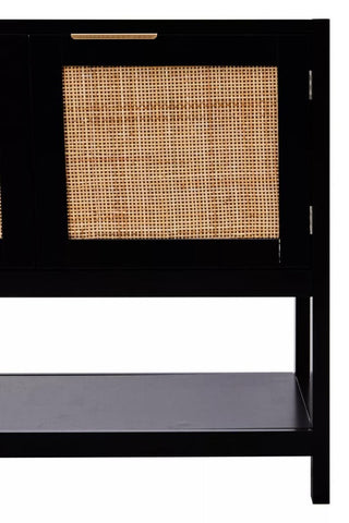 Black wood side cabinet featuring two doors with rattan inserts, showcasing a sleek design and a lower shelf for additional storage. The cabinet has a modern aesthetic suitable for various home decor styles