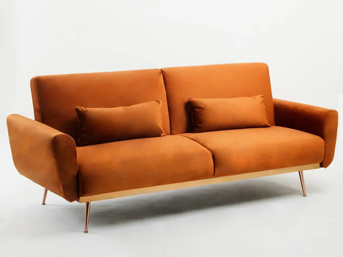 Modern orange velvet sofa with metal legs and two matching bolster cushions