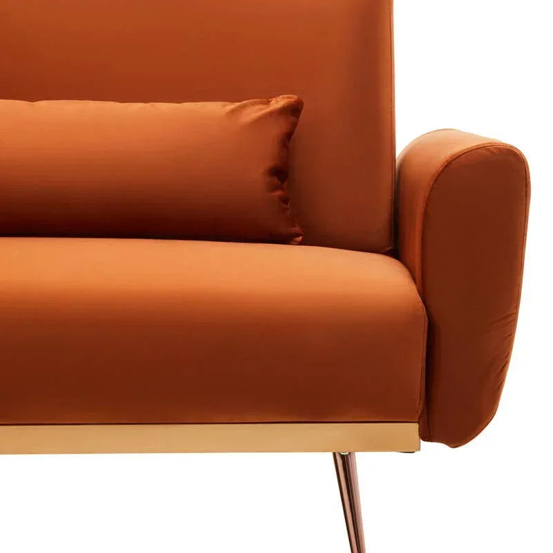 Modern orange sofa with cushion, gold trim, and metal legs, front arm detail view