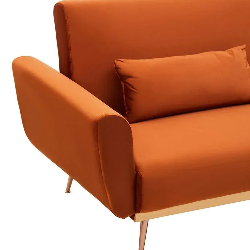 Orange fabric sofa with metal legs and matching lumbar cushion, close-up side view