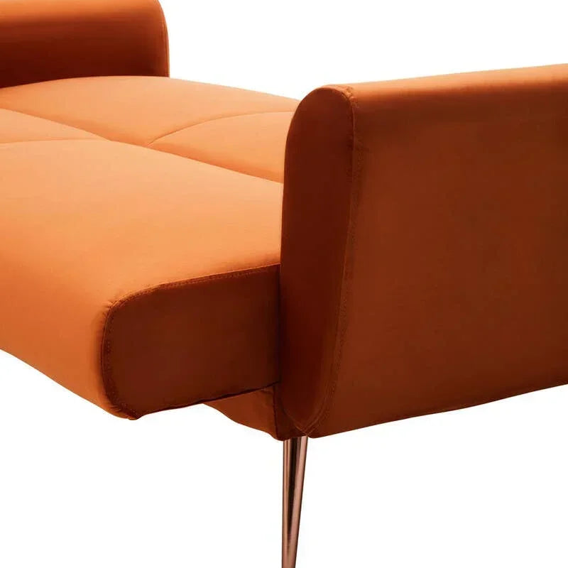 Orange sofa bed with metal legs, tufted seat and square armrest, side angle view