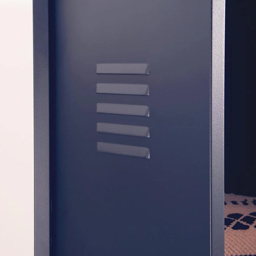 Close-up of navy metal locker cabinet door partially open with vent detail