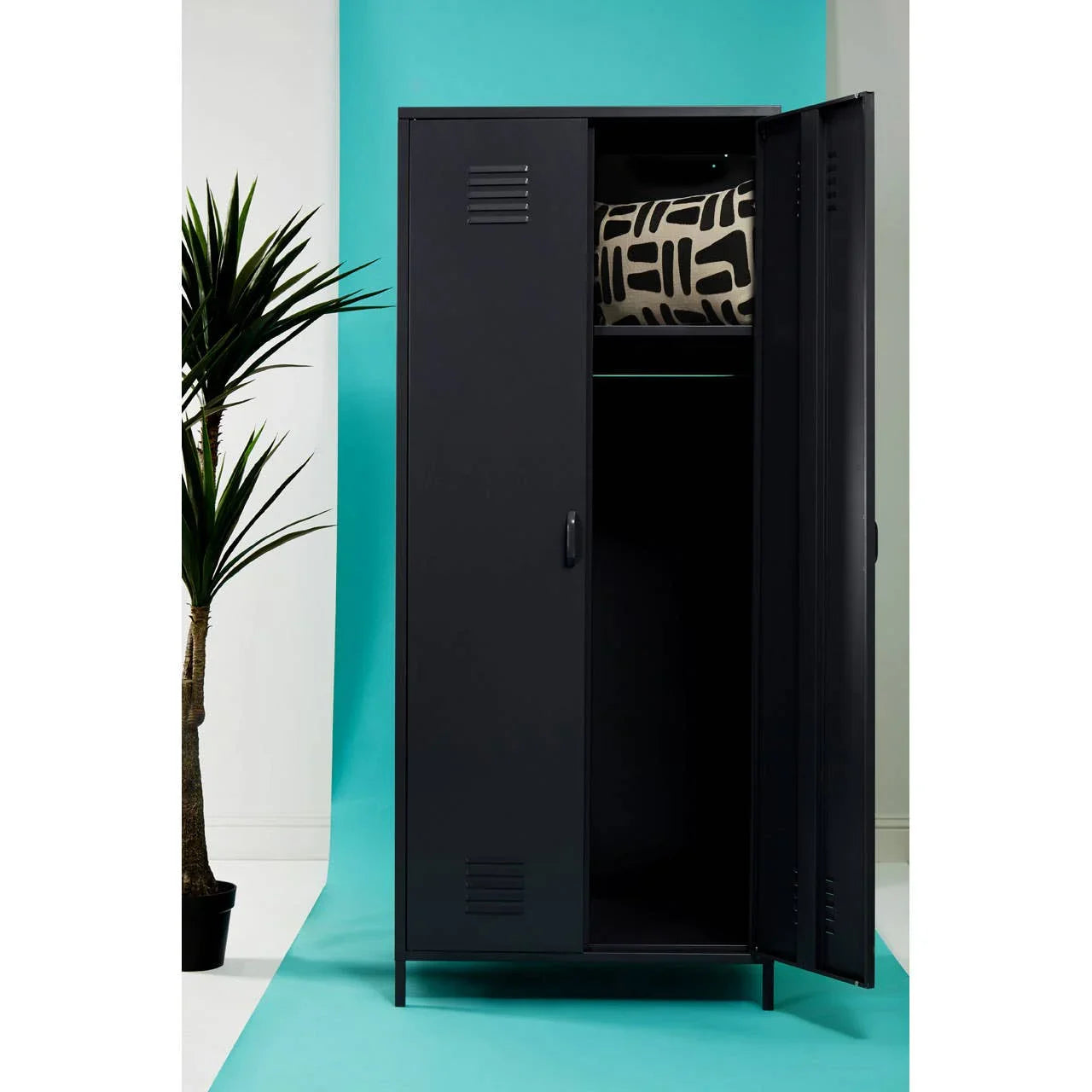 Black metal storage locker with open door and patterned cushion on upper shelf