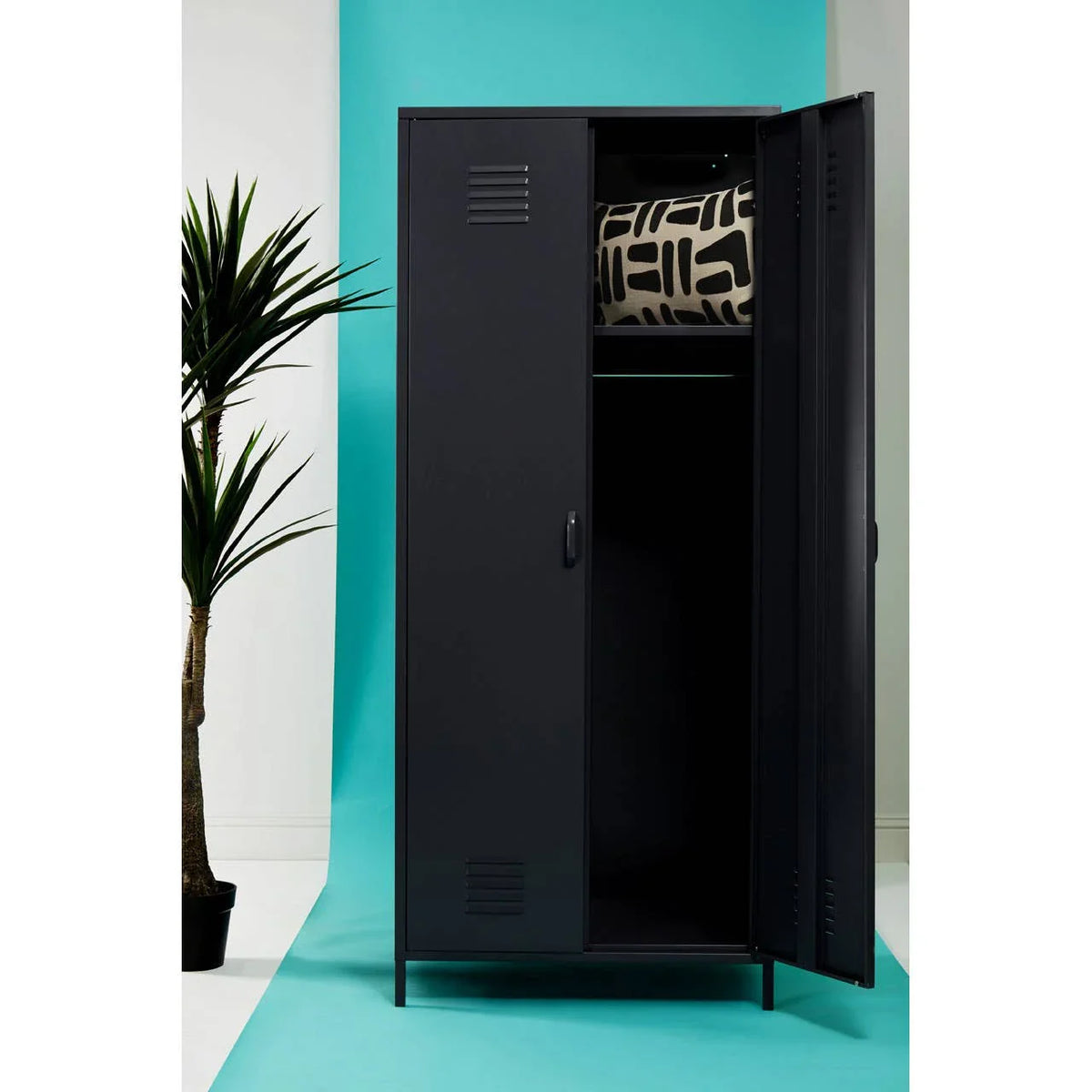 Black metal storage locker with open door and patterned cushion on upper shelf