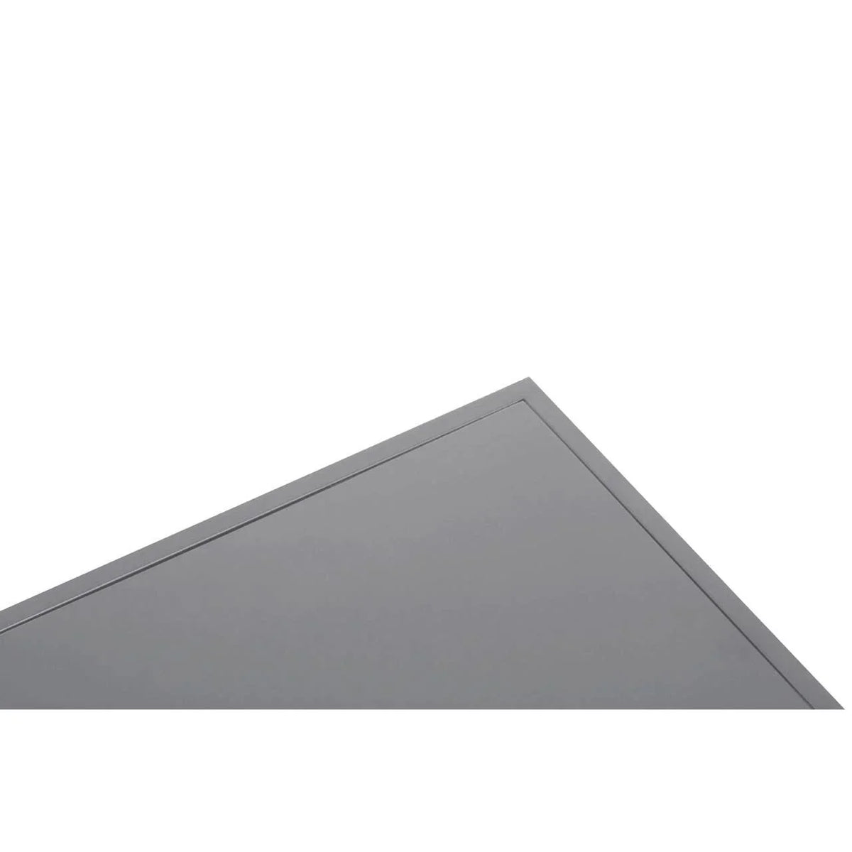 Corner detail of grey metal table top with smooth finish