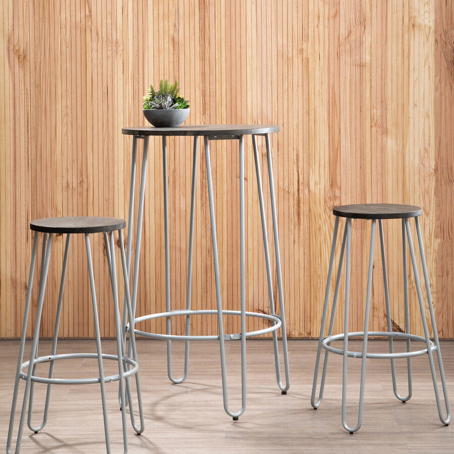 Three-piece bar table and stool set featuring a sleek elm wood tabletop and two matching stools with metal frames. The set is positioned against a light wooden backdrop, with a small potted plant on the table, creating a modern and inviting atmosphere