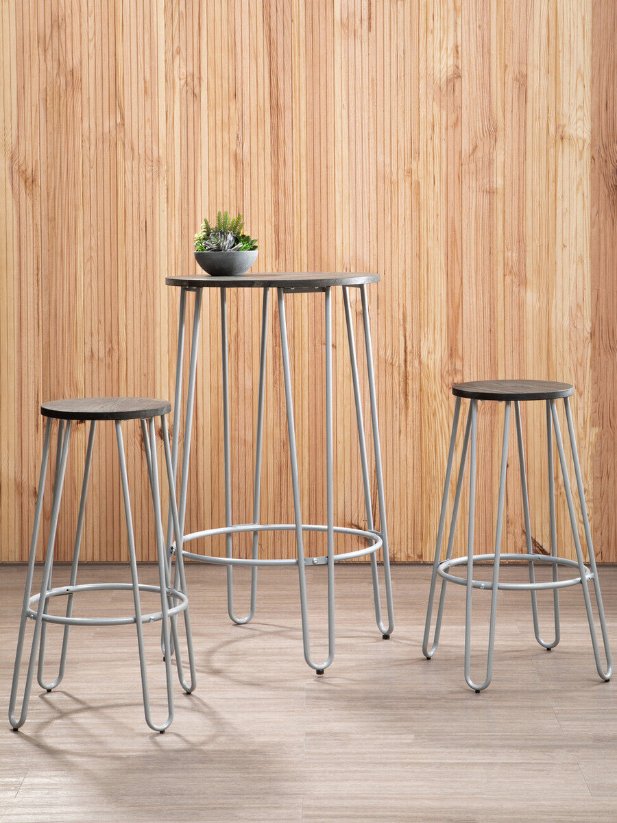 Three-piece bar table and stool set featuring a sleek elm wood tabletop and two matching stools with metal frames. The set is positioned against a light wooden backdrop, with a small potted plant on the table, creating a modern and inviting atmosphere