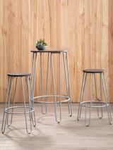 Three-piece bar table and stool set featuring a sleek elm wood tabletop and two matching stools with metal frames. The set is positioned against a light wooden backdrop, with a small potted plant on the table, creating a modern and inviting atmosphere