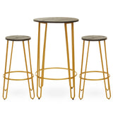 A three-piece bar table and stool set featuring a round table with a gold finish and a smooth surface, accompanied by two matching stools with round seats and slender gold legs. The design is modern and minimalist, suitable for various home decor styles