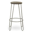 Bar stool featuring a round wooden seat with a grey finish, supported by a sleek metal frame in a light grey color. The design includes four slender legs and a circular footrest for added comfort