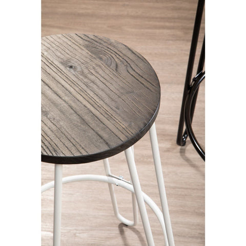 A close-up view of a bar stool featuring a round wooden seat with a rustic finish and a white metal frame. The stool is positioned on a light-colored wooden floor, highlighting its modern design and contrasting materials