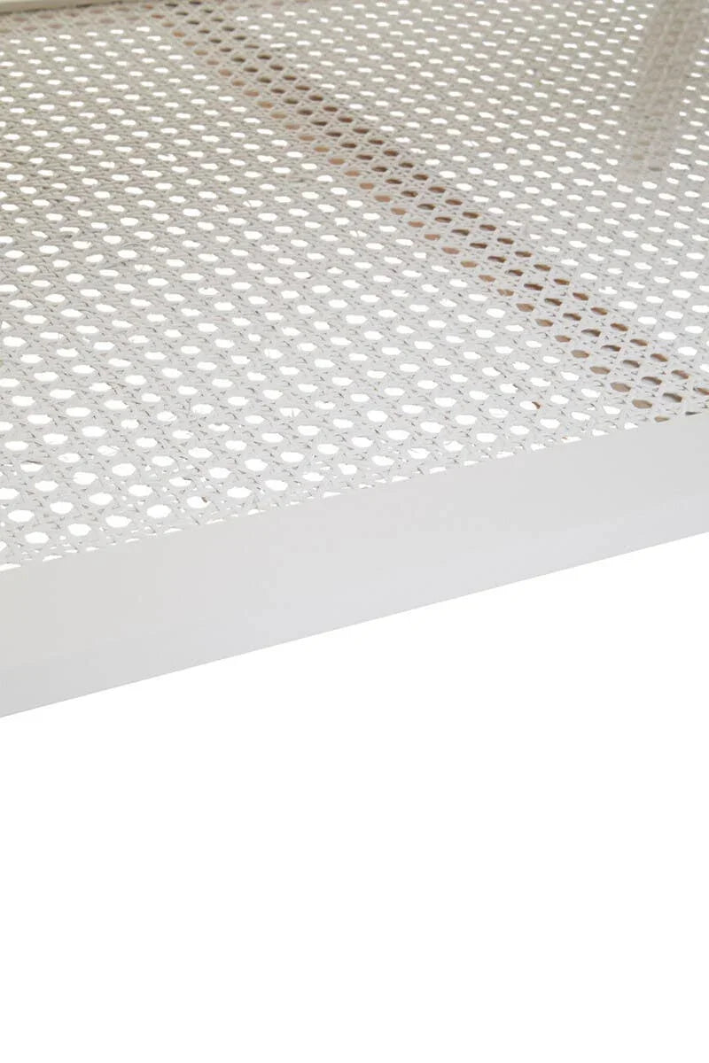 White metal mesh furniture surface with perforated pattern, corner view