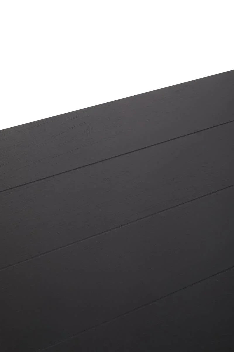 Close-up of black wood dining table surface with subtle grain and lined texture