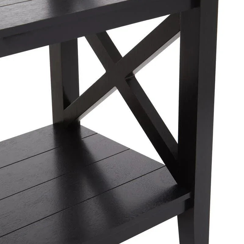 Black wooden shelving unit with X-frame side detail and slatted shelves, close-up view