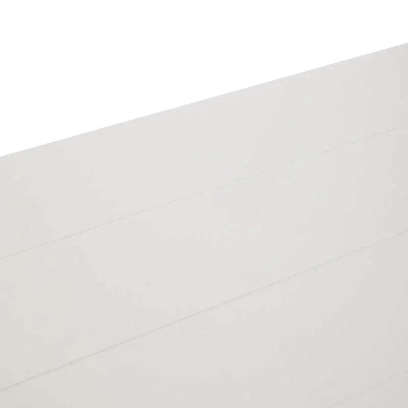 Closeup of white panelled furniture surface with subtle horizontal lines