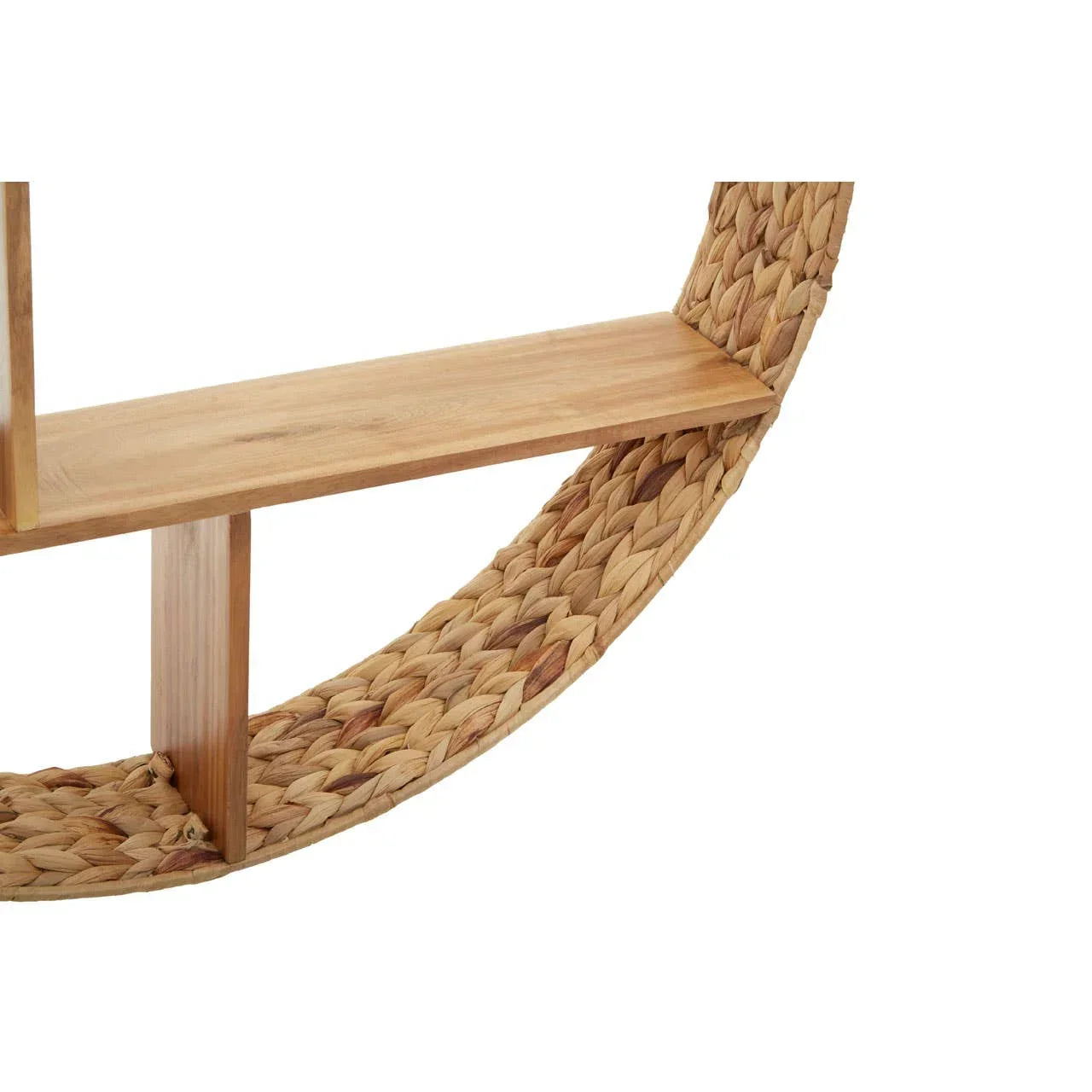 Close view of round wicker wall shelf with natural wood panel and woven frame detail