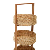 Three-tier storage caddy featuring round woven baskets made from water hyacinth, supported by a wooden frame with a handle for easy transport. The natural tones of the baskets and the light wood create a warm, organic look suitable for home decor