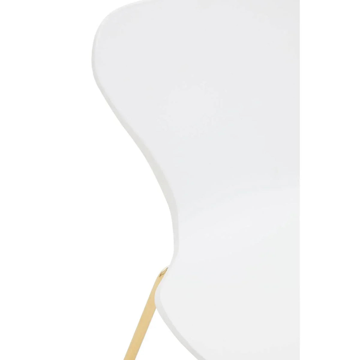 Close detail of white dining chair with gold metal leg