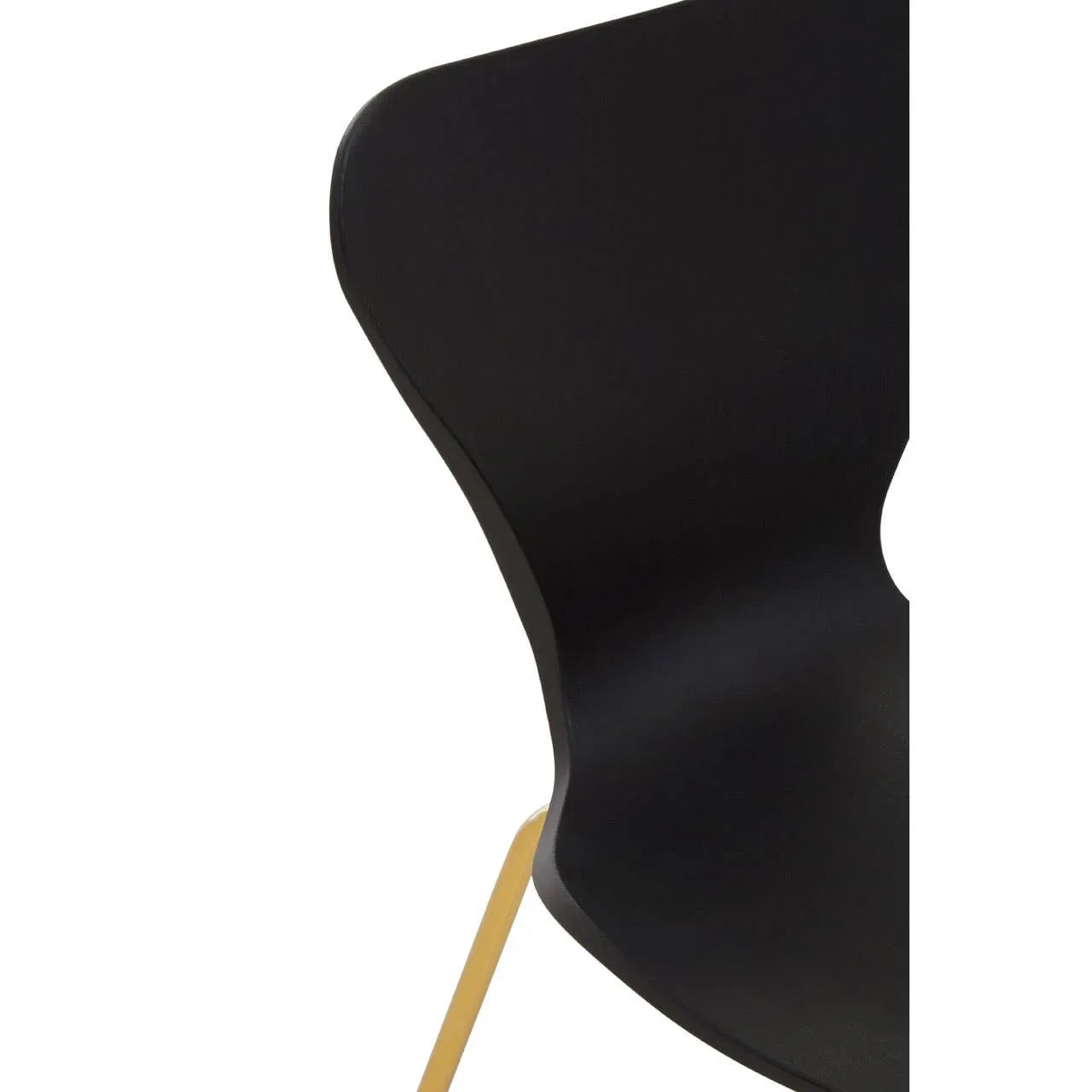Black dining chair with curved backrest and yellow metal leg, close-up view